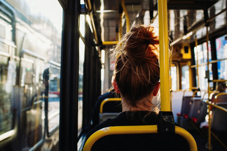 female-sitting-in-the-bus-captured-from-behind